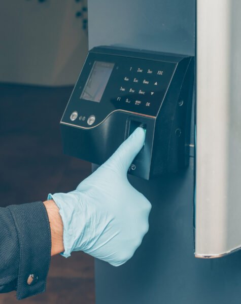 man-getting-intercom-read-his-fingerprint-open-door-with-gloves